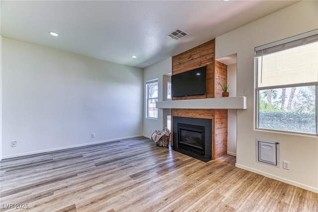 7900 Dutch Canyon Ct, Las Vegas, NV 89131 - unfurnished living room featuring wood finished floors, a large fireplace, and recessed lighting