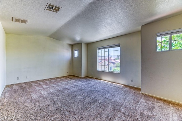 7900 Dutch Canyon Ct, Las Vegas, NV 89131 - empty room featuring carpet floors, a textured ceiling, and vaulted ceiling