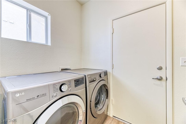 7900 Dutch Canyon Ct, Las Vegas, NV 89131 - washroom with independent washer and dryer and light wood-style floors
