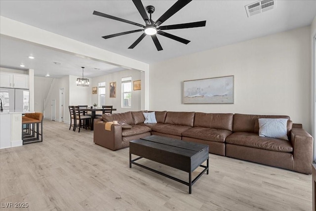 4030 Midnight Crest Ave, North Las Vegas, NV 89031 - living area with a chandelier, light wood-style floors, ceiling fan, and recessed lighting