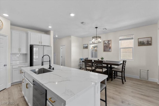 4030 Midnight Crest Ave, North Las Vegas, NV 89031 - kitchen with dishwasher, refrigerator, a sink, light wood finished floors, and recessed lighting