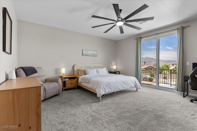 4030 Midnight Crest Ave, North Las Vegas, NV 89031 - carpeted bedroom with access to outside, a mountain view, and ceiling fan