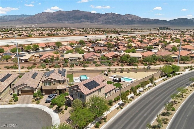 4030 Midnight Crest Ave, North Las Vegas, NV 89031 - aerial perspective of suburban area with a mountain backdrop