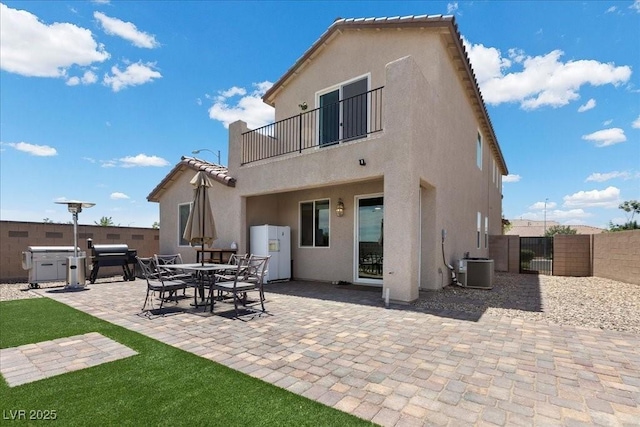 4030 Midnight Crest Ave, North Las Vegas, NV 89031 - back of house with a balcony, a gate, stucco siding, and a patio area
