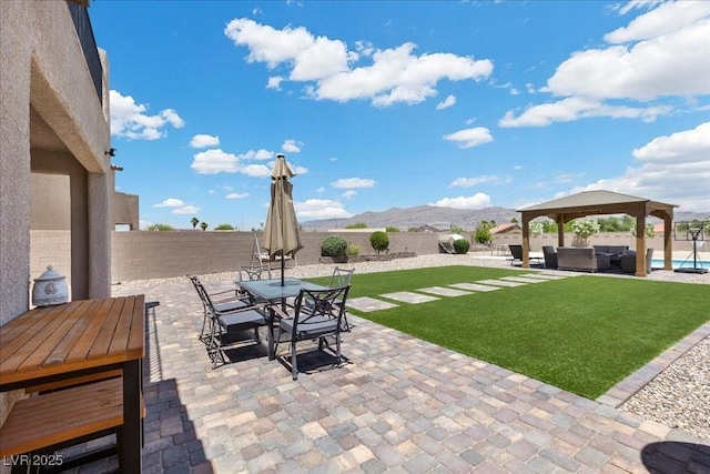 4030 Midnight Crest Ave, North Las Vegas, NV 89031 - view of patio / terrace featuring outdoor dining area, outdoor lounge area, a gazebo, and a mountain view