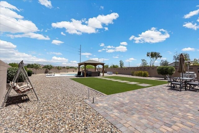 4030 Midnight Crest Ave, North Las Vegas, NV 89031 - fenced backyard featuring a gazebo, a patio, and an outdoor pool