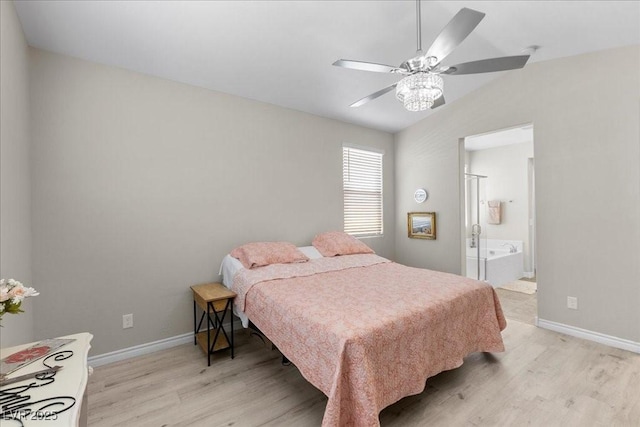 4030 Midnight Crest Ave, North Las Vegas, NV 89031 - bedroom featuring light wood-type flooring, vaulted ceiling, baseboards, ensuite bathroom, and a ceiling fan