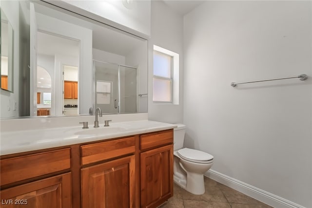 512 Los Dolces St, Las Vegas, NV 89138 - full bathroom featuring vanity, toilet, a shower with shower door, tile patterned flooring, and baseboards