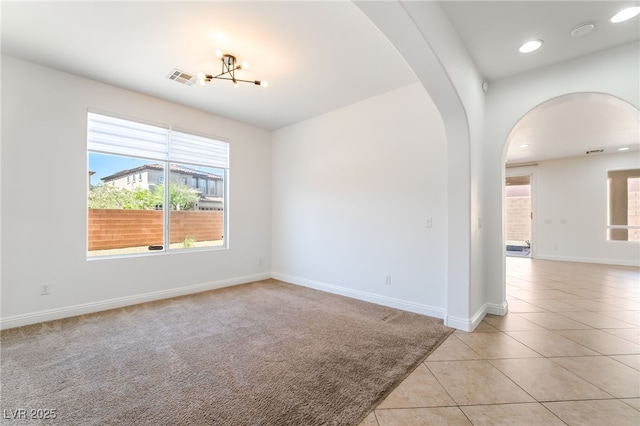 512 Los Dolces St, Las Vegas, NV 89138 - empty room featuring arched walkways, a chandelier, light tile patterned floors, baseboards, and recessed lighting