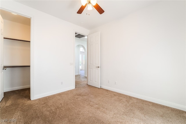 512 Los Dolces St, Las Vegas, NV 89138 - unfurnished bedroom with carpet flooring, arched walkways, and baseboards