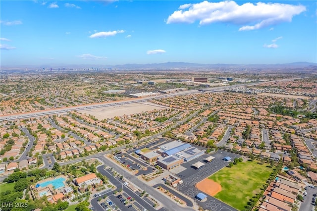 512 Los Dolces St, Las Vegas, NV 89138 - aerial view of property's location featuring a mountainous background and nearby suburban area