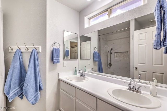 1073 Nordyke Ave, Henderson, NV 89015 - bathroom featuring a marble finish shower and double vanity