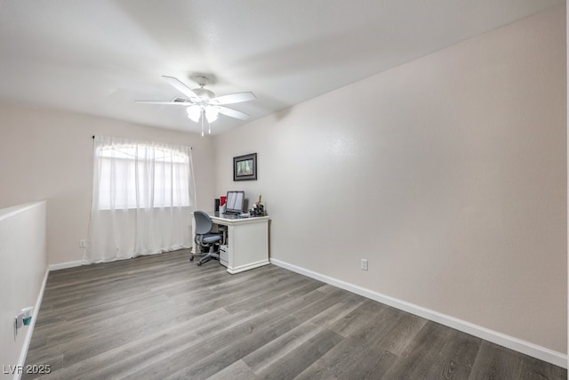 1073 Nordyke Ave, Henderson, NV 89015 - unfurnished office with ceiling fan, wood finished floors, and baseboards