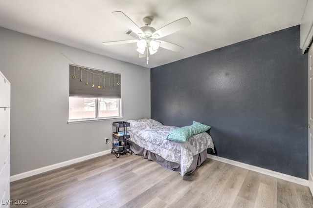 1073 Nordyke Ave, Henderson, NV 89015 - bedroom featuring wood finished floors, baseboards, and a ceiling fan
