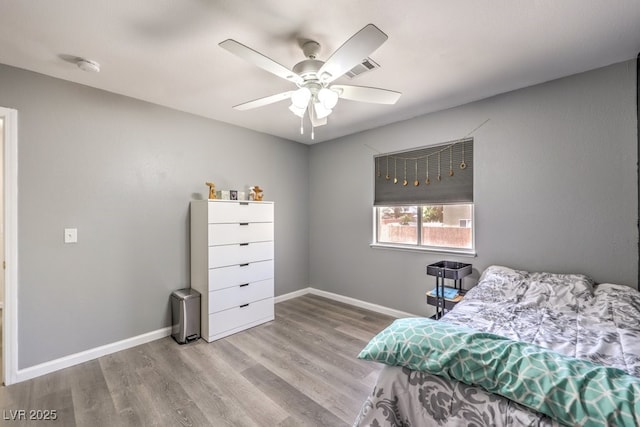 1073 Nordyke Ave, Henderson, NV 89015 - bedroom featuring wood finished floors, baseboards, and a ceiling fan