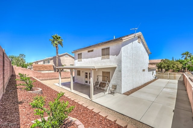 1073 Nordyke Ave, Henderson, NV 89015 - back of property with a patio area, stucco siding, and a fenced backyard