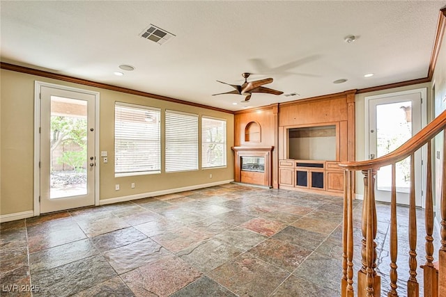 1737 Cypress Manor Dr, Henderson, NV 89012 - unfurnished living room with crown molding, stone tile floors, baseboards, a ceiling fan, and recessed lighting