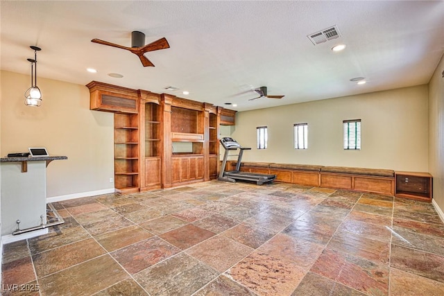 1737 Cypress Manor Dr, Henderson, NV 89012 - workout room featuring a ceiling fan, stone tile floors, baseboards, and recessed lighting