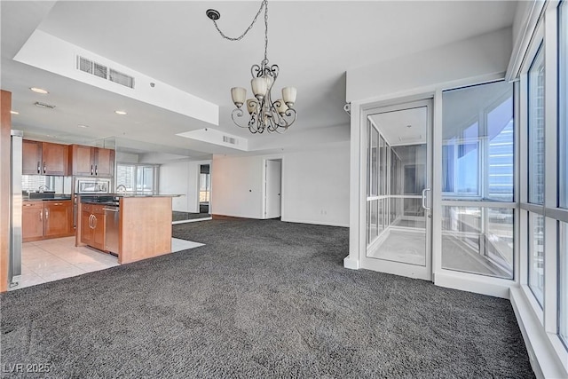 4525 Dean Martin Dr Unit 909, Las Vegas, NV 89103 - kitchen with light colored carpet, plenty of natural light, appliances with stainless steel finishes, and recessed lighting
