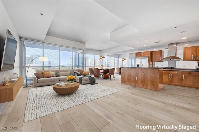 4525 Dean Martin Dr Unit 909, Las Vegas, NV 89103 - living room with healthy amount of natural light, light wood-type flooring, and a view of city