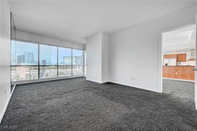 4525 Dean Martin Dr Unit 909, Las Vegas, NV 89103 - spare room with dark colored carpet and a view of city