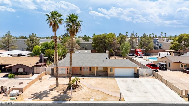 4205 Thicket Ave, North Las Vegas, NV 89031 - view of front of house featuring concrete driveway, an attached garage, and a residential view