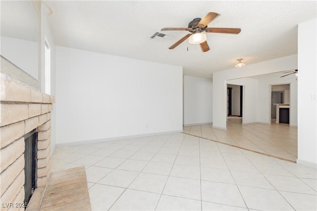 4205 Thicket Ave, North Las Vegas, NV 89031 - unfurnished living room featuring a ceiling fan, a brick fireplace, baseboards, and light tile patterned floors