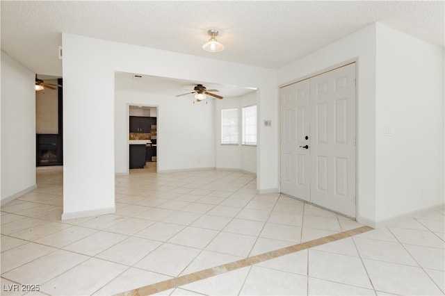 4205 Thicket Ave, North Las Vegas, NV 89031 - entryway featuring a ceiling fan, light tile patterned flooring, and a textured ceiling