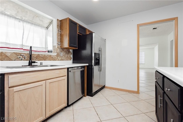 4205 Thicket Ave, North Las Vegas, NV 89031 - kitchen with stainless steel appliances, healthy amount of natural light, a sink, and tasteful backsplash
