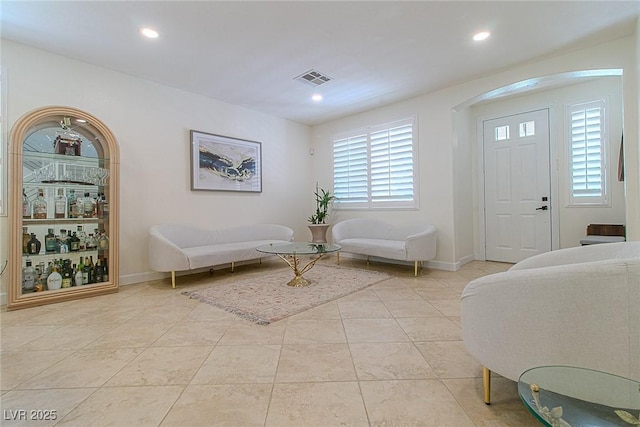 10744 Balsam Creek Ave, Las Vegas, NV 89144 - entryway with recessed lighting, baseboards, arched walkways, and light tile patterned floors