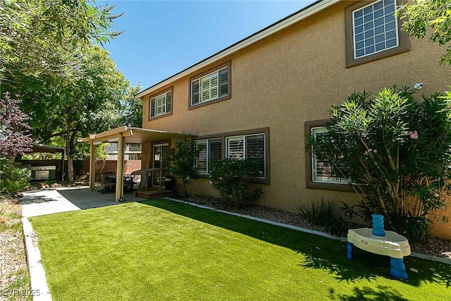 10744 Balsam Creek Ave, Las Vegas, NV 89144 - back of property with stucco siding and a patio area