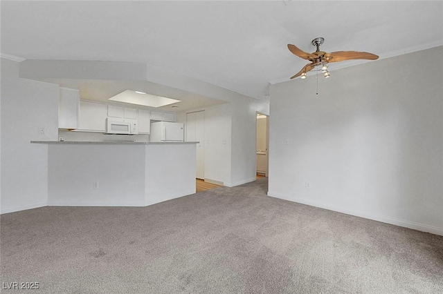 8600 W Charleston Blvd Unit 1128, Las Vegas, NV 89117 - unfurnished living room featuring light colored carpet, a ceiling fan, and baseboards