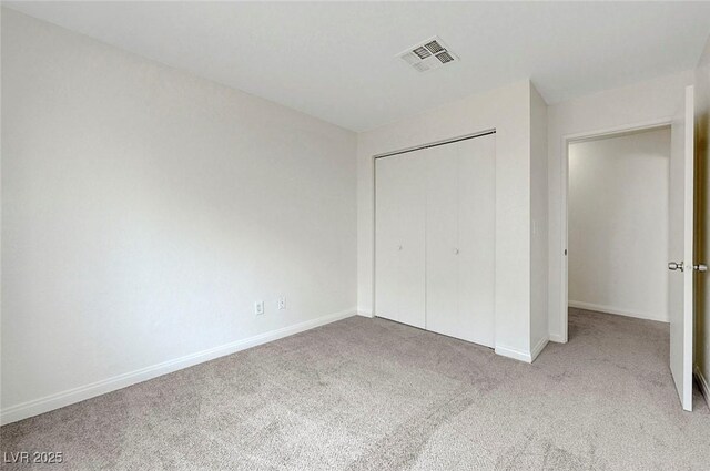 8600 W Charleston Blvd Unit 1128, Las Vegas, NV 89117 - unfurnished bedroom with carpet, baseboards, and a closet