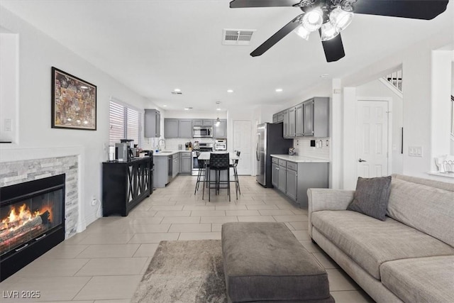 600 Beresford Ave, Las Vegas, NV 89123 - living area featuring a ceiling fan, a fireplace, and recessed lighting