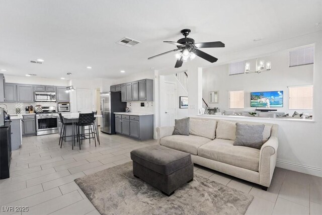 600 Beresford Ave, Las Vegas, NV 89123 - living area with light tile patterned floors, ceiling fan, a chandelier, and recessed lighting