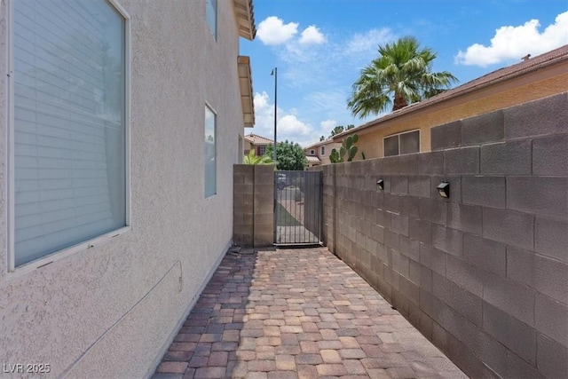 600 Beresford Ave, Las Vegas, NV 89123 - view of property exterior with stucco siding and a gate