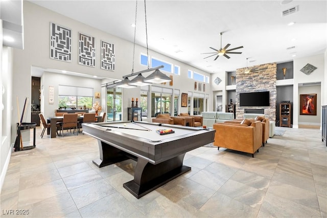 7504 Frittata Ave, Las Vegas, NV 89113 - game room with ceiling fan, pool table, a towering ceiling, a fireplace, and recessed lighting
