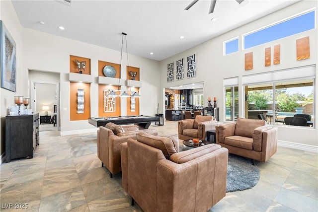7504 Frittata Ave, Las Vegas, NV 89113 - living area featuring pool table, a towering ceiling, healthy amount of natural light, baseboards, and ceiling fan