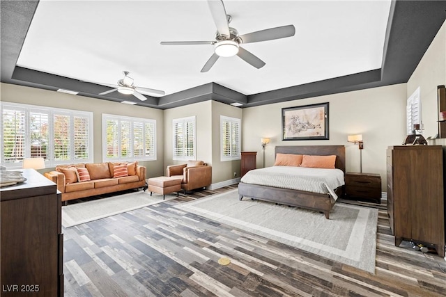 7504 Frittata Ave, Las Vegas, NV 89113 - bedroom featuring a raised ceiling, wood finished floors, and ceiling fan