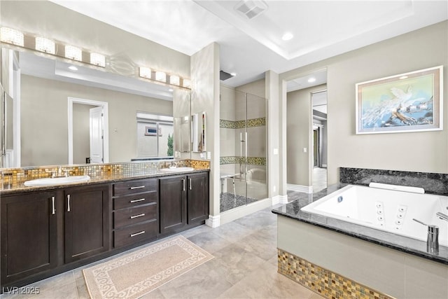 7504 Frittata Ave, Las Vegas, NV 89113 - bathroom featuring a shower stall, double vanity, a tub with jets, and recessed lighting