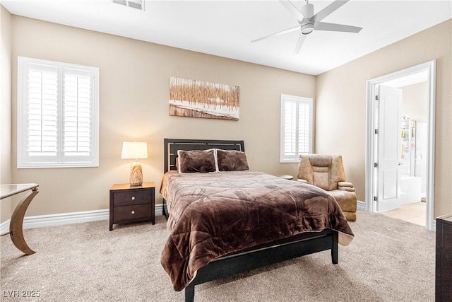7504 Frittata Ave, Las Vegas, NV 89113 - bedroom featuring carpet floors, baseboards, connected bathroom, and a ceiling fan