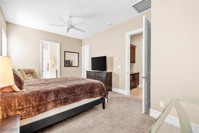 7504 Frittata Ave, Las Vegas, NV 89113 - bedroom with light carpet, baseboards, and a ceiling fan