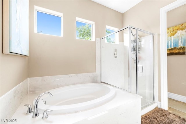 7504 Frittata Ave, Las Vegas, NV 89113 - bathroom featuring a shower stall and a bath
