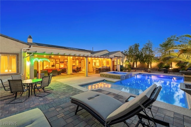 7504 Frittata Ave, Las Vegas, NV 89113 - view of pool with outdoor dining space, a patio area, an outdoor hangout area, and a pool with connected hot tub