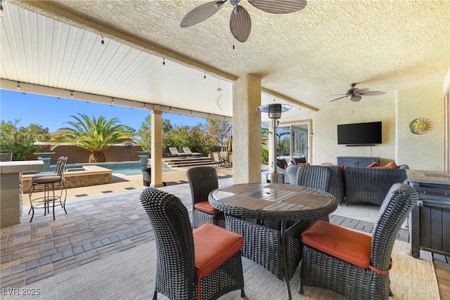 7504 Frittata Ave, Las Vegas, NV 89113 - view of patio with ceiling fan, outdoor dining space, an outdoor pool, and a jacuzzi