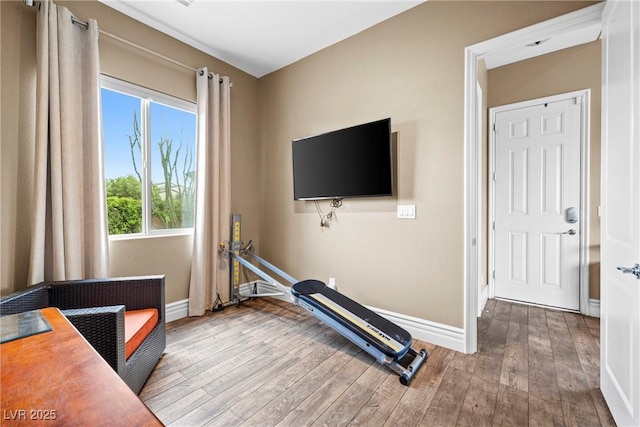 7504 Frittata Ave, Las Vegas, NV 89113 - workout area featuring baseboards and hardwood / wood-style flooring