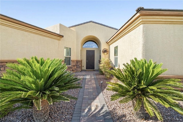 7504 Frittata Ave, Las Vegas, NV 89113 - doorway to property with stucco siding and stone siding
