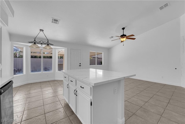 5437 Escallonia St, Las Vegas, NV 89149 - kitchen featuring dishwasher, ceiling fan, white cabinets, light stone countertops, and pendant lighting