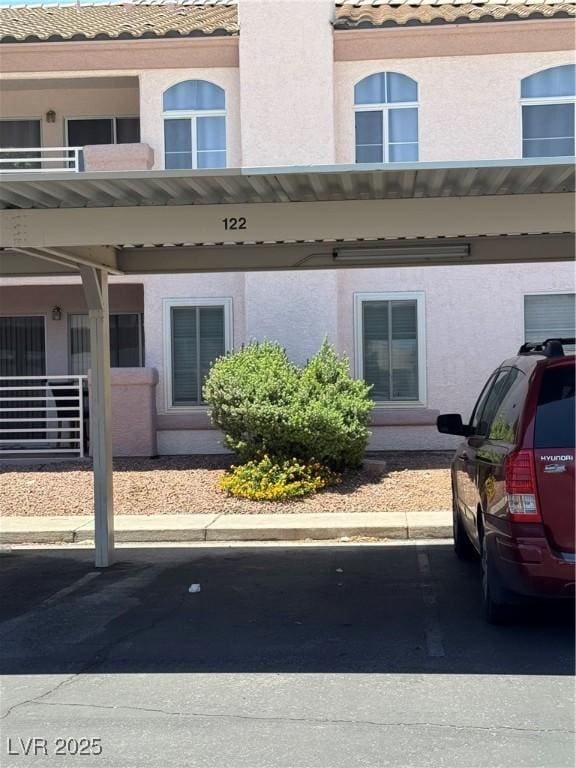 4555 E Sahara Ave Unit 122, Las Vegas, NV 89104 - view of property featuring covered parking