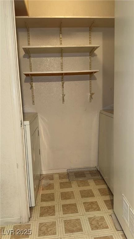 4555 E Sahara Ave Unit 122, Las Vegas, NV 89104 - washroom with washer / clothes dryer and light flooring